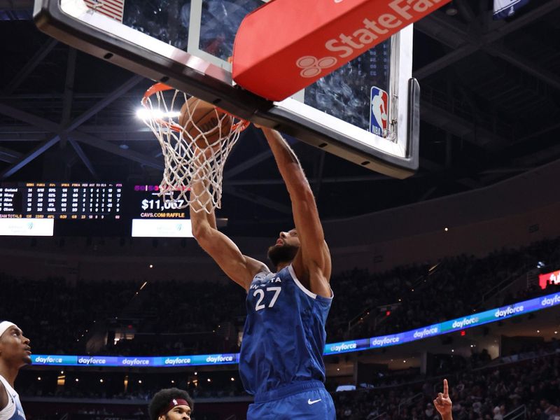 CLEVELAND, OH - March 8: Rudy Gobert #27 of the Minnesota Timberwolves drives to the basket during the game against the Cleveland Cavaliers on March 8, 2024 at Rocket Mortgage FieldHouse in Cleveland, Ohio. NOTE TO USER: User expressly acknowledges and agrees that, by downloading and/or using this Photograph, user is consenting to the terms and conditions of the Getty Images License Agreement. Mandatory Copyright Notice: Copyright 2024 NBAE (Photo by Lauren Leigh Bacho/NBAE via Getty Images)