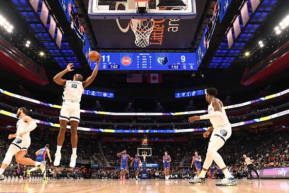 DETROIT, MI - DECEMBER 6: Bismack Biyombo #18 of the Memphis Grizzlies grabs the rebound during the game  on December 6, 2023 at Little Caesars Arena in Detroit, Michigan. NOTE TO USER: User expressly acknowledges and agrees that, by downloading and/or using this photograph, User is consenting to the terms and conditions of the Getty Images License Agreement. Mandatory Copyright Notice: Copyright 2023 NBAE (Photo by Chris Schwegler/NBAE via Getty Images)