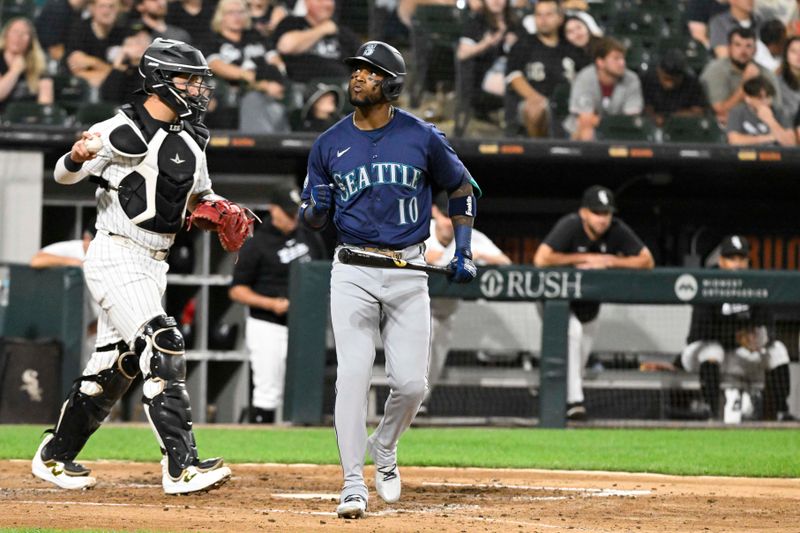 Jul 26, 2024; Chicago, Illinois, USA;  Seattle Mariners outfielder Victor Robles (10) reacts after drawing a walk during the fifth inning against the Chicago White Sox at Guaranteed Rate Field. Mandatory Credit: Matt Marton-USA TODAY Sports