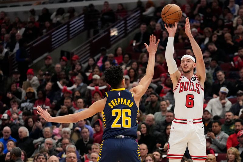 CHICAGO, ILLINOIS - MARCH 27: Alex Caruso #6 of the Chicago Bulls shoots a three-point basket against Ben Sheppard #26 of the Indiana Pacers during the first half at the United Center on March 27, 2024 in Chicago, Illinois. NOTE TO USER: User expressly acknowledges and agrees that, by downloading and or using this photograph, User is consenting to the terms and conditions of the Getty Images License Agreement. (Photo by Patrick McDermott/Getty Images)