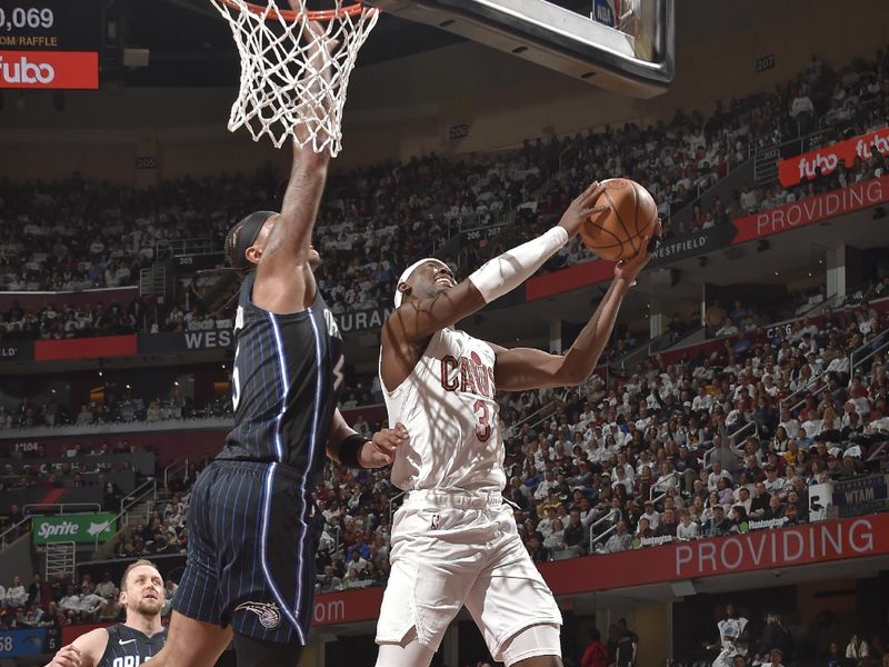 CLEVELAND, OH - APRIL 20: Caris LeVert #3 of the Cleveland Cavaliers drives to the basket during Round 1 Game 1 of the 2024 NBA Playoffs against the Orlando Magic on April 20, 2024 at Rocket Mortgage FieldHouse in Cleveland, Ohio. NOTE TO USER: User expressly acknowledges and agrees that, by downloading and/or using this Photograph, user is consenting to the terms and conditions of the Getty Images License Agreement. Mandatory Copyright Notice: Copyright 2024 NBAE (Photo by David Liam Kyle/NBAE via Getty Images)