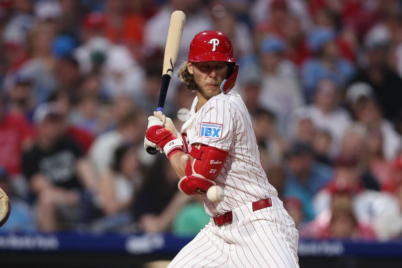 May 3, 2025; Philadelphia, Pennsylvania, USA; Philadelphia Phillies third base Alec Bohm (28) is hit by a pitch during the fifth inning against the Arizona Diamondbacks at Citizens Bank Park. Mandatory Credit: Bill Streicher-Imagn Images
