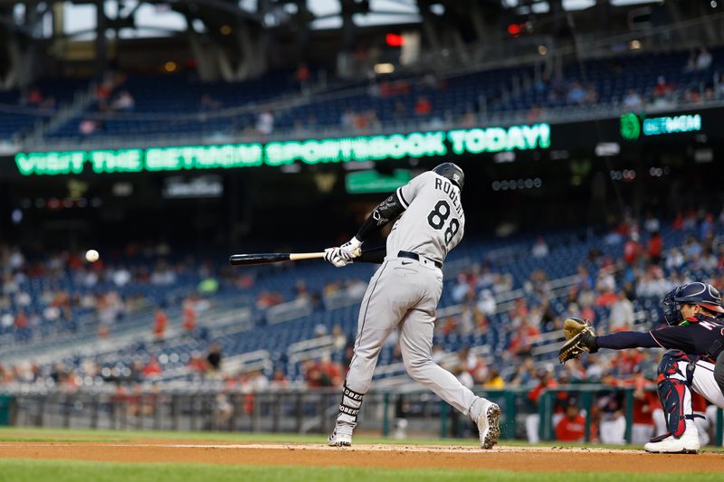 Sep 19, 2023; Washington, District of Columbia, USA; Chicago White Sox center fielder Luis Robert Jr. (88) singles against the Washington Nationals during the first inning at Nationals Park. Mandatory Credit: Geoff Burke-USA TODAY Sports