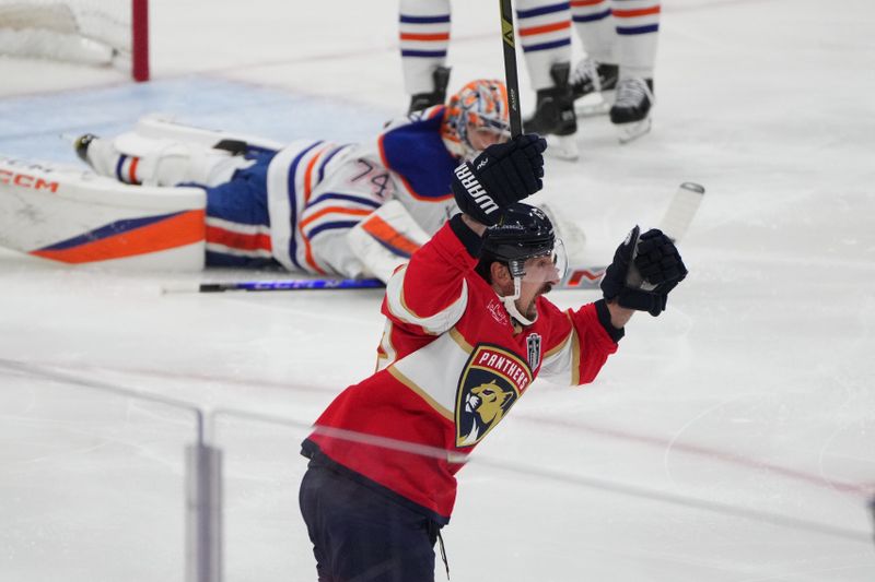 Jun 9, 2025; Sunrise, Florida, USA; Florida Panthers forward Brad Marchand (63) celebrates scoring against Edmonton Oilers goaltender Stuart Skinner (74) during the first period in game three of the 2025 Stanley Cup Final at Amerant Bank Arena. Mandatory Credit: Jim Rassol-Imagn Images