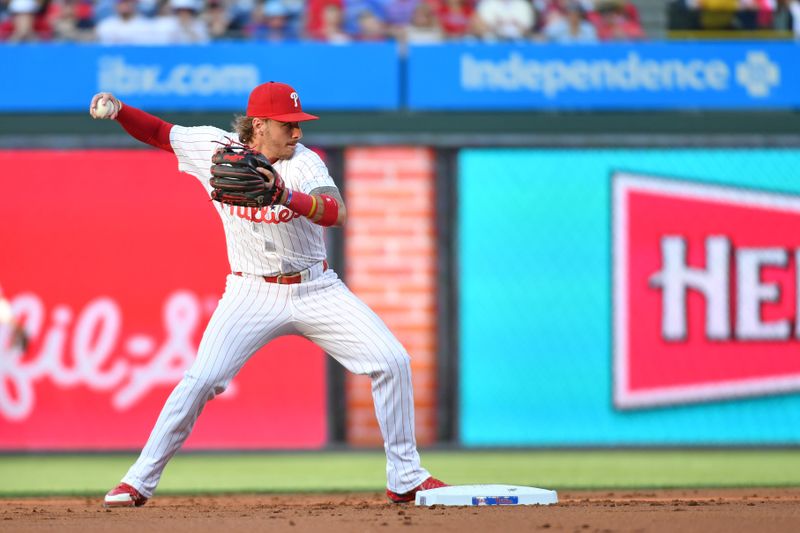 Jun 17, 2024; Philadelphia, Pennsylvania, USA; Philadelphia Phillies second base Bryson Stott (5) gets force out during the second inning against the San Diego Padres at Citizens Bank Park. Mandatory Credit: Eric Hartline-USA TODAY Sports