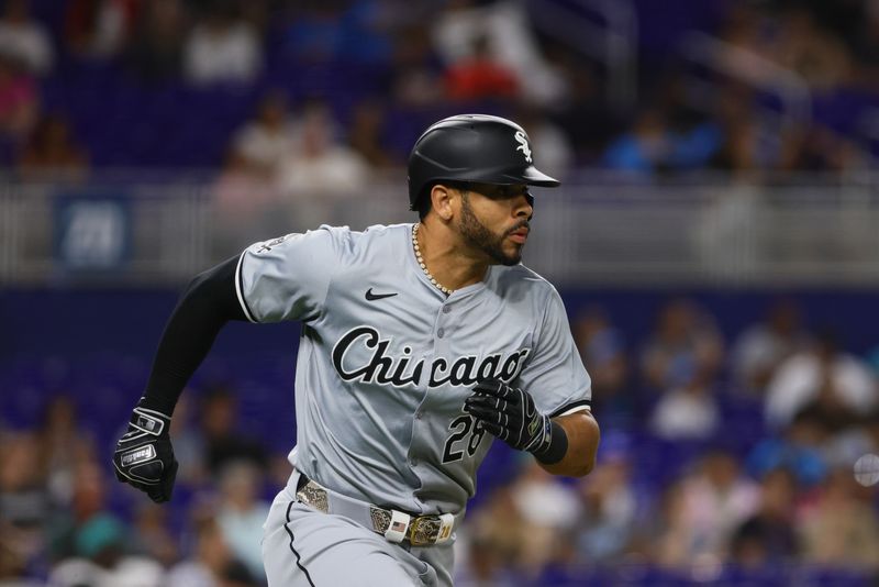 Jul 5, 2024; Miami, Florida, USA; Chicago White Sox right fielder Tommy Pham (28) runs toward first base after hitting a single against the Miami Marlins during the seventh inning at loanDepot Park. Mandatory Credit: Sam Navarro-USA TODAY Sports