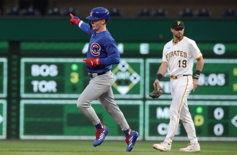 Apr 29, 2025; Pittsburgh, Pennsylvania, USA;  Chicago Cubs center fielder Pete Crow-Armstrong (4) gestures as he circles the bases on a two run home run against the Pittsburgh Pirates during the fifth inning at PNC Park. Mandatory Credit: Charles LeClaire-Imagn Images