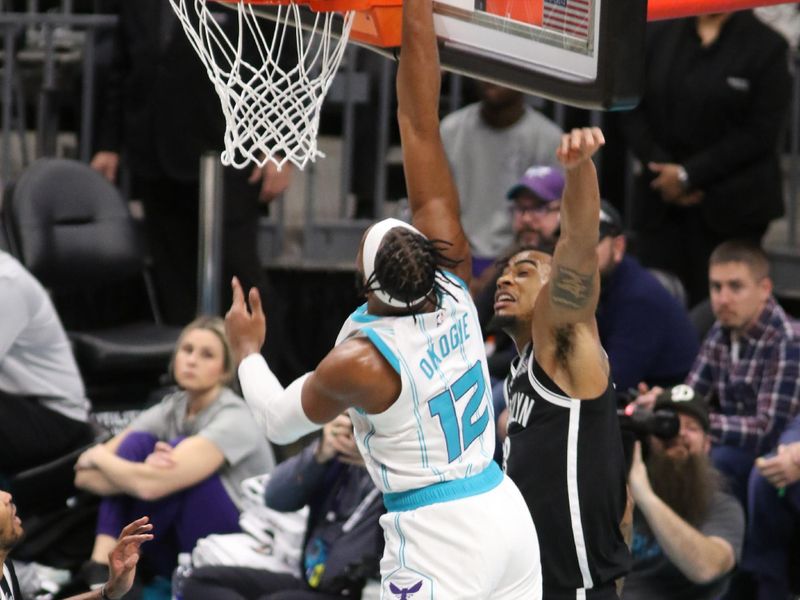 CHARLOTTE, NC - JANUARY 29:  Josh Okogie #12 of the Charlotte Hornets dunks the ball during the game against the Brooklyn Nets on January 29, 2025 at Spectrum Center in Charlotte, North Carolina. NOTE TO USER: User expressly acknowledges and agrees that, by downloading and or using this photograph, User is consenting to the terms and conditions of the Getty Images License Agreement. Mandatory Copyright Notice: Copyright 2025 NBAE (Photo by Brock Williams-Smith/NBAE via Getty Images)