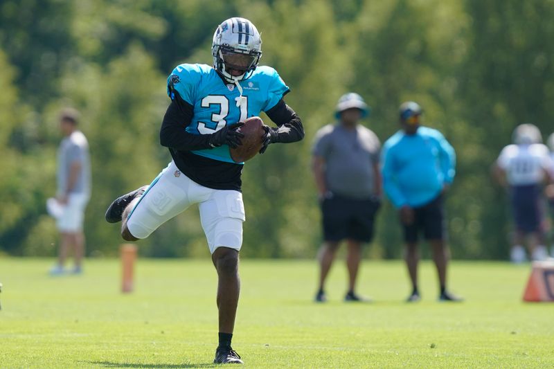 Carolina Panthers safety Juston Burris (31) makes a catch during a NFL football joint practice with the New England Patriots, Tuesday, Aug. 16, 2022, in Foxborough, Mass. (AP Photo/Steven Senne)