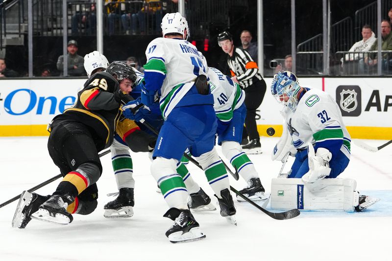 Feb 4, 2026; Las Vegas, Nevada, USA; Vancouver Canucks goaltender Kevin Lankinen (32) makes a save against Vegas Golden Knights left wing Ivan Barbashev (49) during the second period at T-Mobile Arena. Mandatory Credit: Stephen R. Sylvanie-Imagn Images