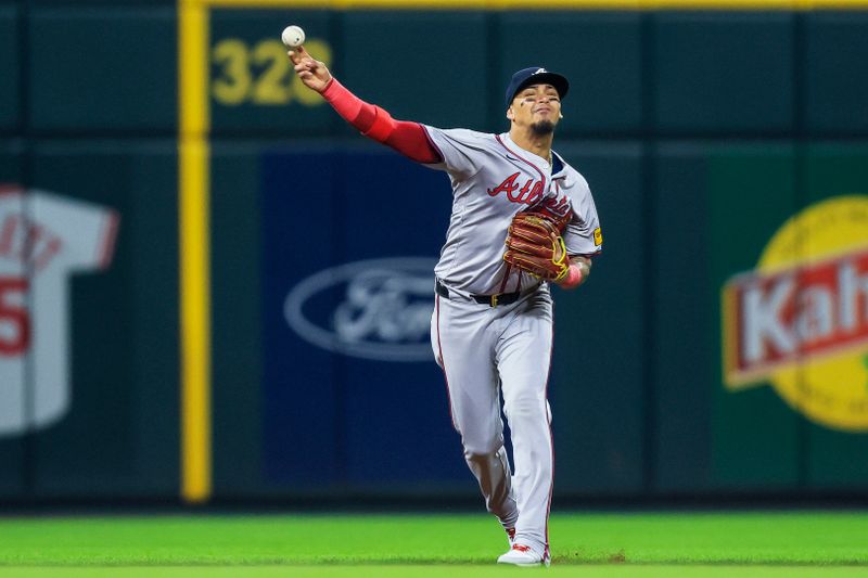 Sep 17, 2024; Cincinnati, Ohio, USA; Atlanta Braves shortstop Orlando Arcia (11) throws to first to get Cincinnati Reds designated hitter Santiago Espinal (not pictured) out in the seventh inning at Great American Ball Park. Mandatory Credit: Katie Stratman-Imagn Images