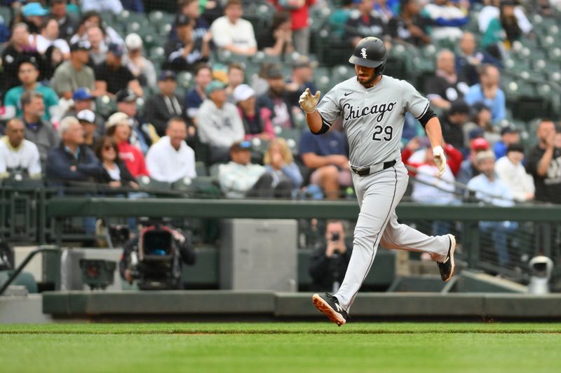 Jun 11, 2024; Seattle, Washington, USA; Chicago White Sox shortstop Paul DeJong (29) runs the bases after hitting a home run against the Seattle Mariners during the third inning at T-Mobile Park. Mandatory Credit: Steven Bisig-USA TODAY Sports