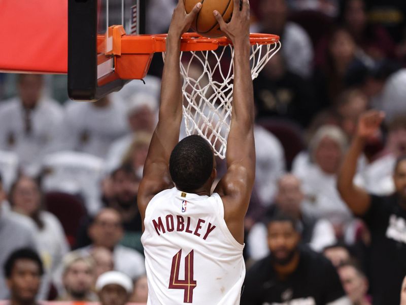 CLEVELAND, OH - APRIL 20: Evan Mobley #4 of the Cleveland Cavaliers dunks the ball during Round One Game One of the 2024 NBA Playoffs against the Orlando Magic on April 20, 2024 at Rocket Mortgage FieldHouse in Cleveland, Ohio. NOTE TO USER: User expressly acknowledges and agrees that, by downloading and/or using this Photograph, user is consenting to the terms and conditions of the Getty Images License Agreement. Mandatory Copyright Notice: Copyright 2024 NBAE (Photo by  Lauren Leigh Bacho/NBAE via Getty Images)