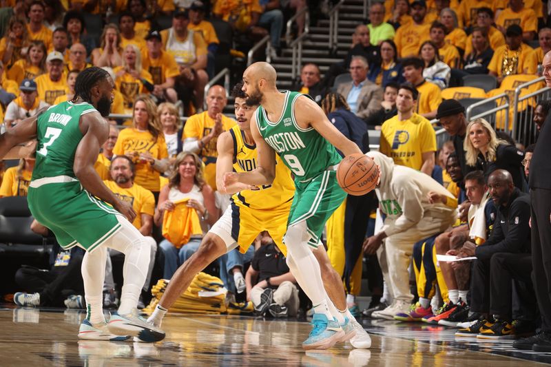 INDIANAPOLIS, IN - MAY 27: Derrick White #9 of the Boston Celtics dribbles the ball during the game against the Indiana Pacers during Game 4 of the Eastern Conference Finals of the 2024 NBA Playoffs on May 27, 2024 at Gainbridge Fieldhouse in Indianapolis, Indiana. NOTE TO USER: User expressly acknowledges and agrees that, by downloading and or using this Photograph, user is consenting to the terms and conditions of the Getty Images License Agreement. Mandatory Copyright Notice: Copyright 2024 NBAE (Photo by Nathaniel S. Butler/NBAE via Getty Images)