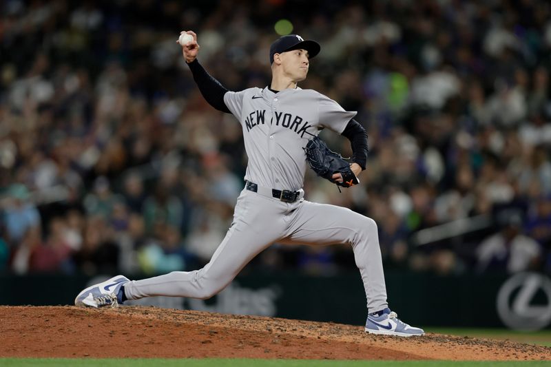 Sep 18, 2024; Seattle, Washington, USA; New York Yankees pitcher Luke Weaver (30) throws against the Seattle Mariners during the eighth inning at T-Mobile Park. Mandatory Credit: John Froschauer-Imagn Images