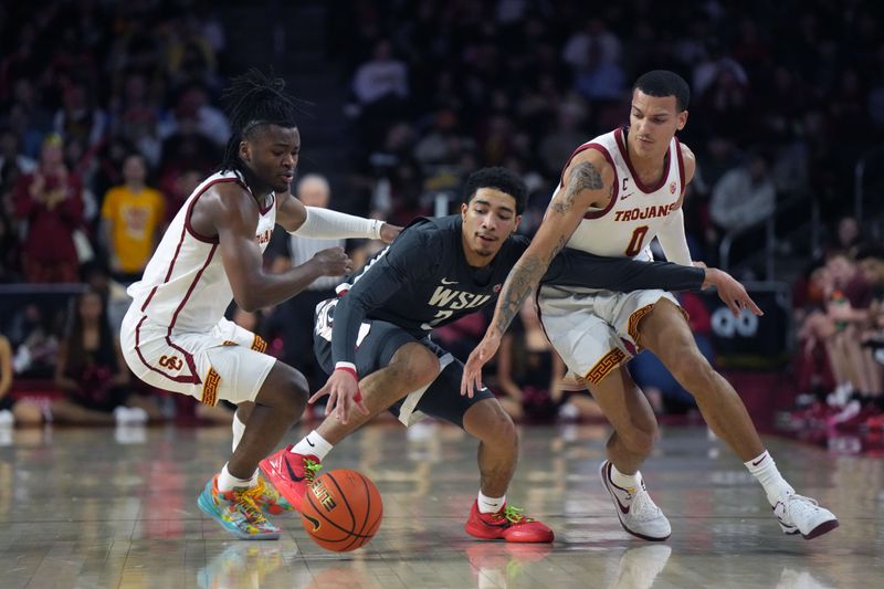 Jan 10, 2024; Los Angeles, California, USA; Washington State Cougars guard Myles Rice (2) battles for the ball with Southern California Trojans guard Isaiah Collier (1) and guard Kobe Johnson (0) in the second half at Galen Center. Mandatory Credit: Kirby Lee-USA TODAY Sports