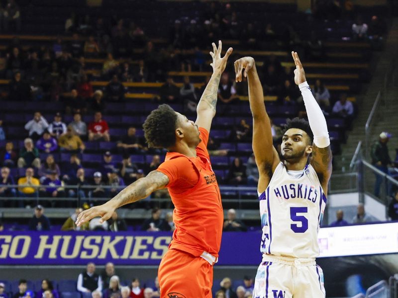 Feb 18, 2023; Seattle, Washington, USA; Washington Huskies guard Jamal Bey (5) attempts a three-pointer against the Oregon State Beavers during the first half at Alaska Airlines Arena at Hec Edmundson Pavilion. Mandatory Credit: Joe Nicholson-USA TODAY Sports