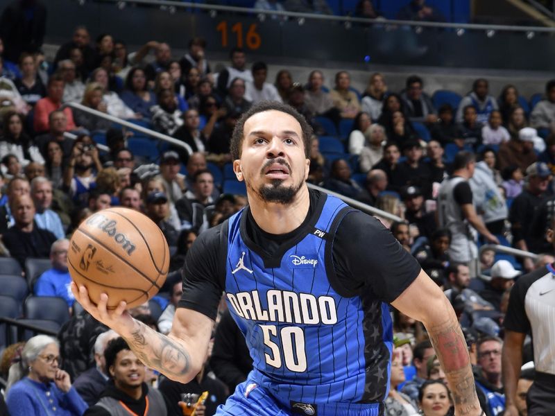 ORLANDO, FL - JANUARY 12: Cole Anthony #50 of the Orlando Magic drives to the basket during the game against the Philadelphia 76ers on January 12, 2025 at Kia Center in Orlando, Florida. NOTE TO USER: User expressly acknowledges and agrees that, by downloading and or using this photograph, User is consenting to the terms and conditions of the Getty Images License Agreement. Mandatory Copyright Notice: Copyright 2025 NBAE (Photo by Fernando Medina/NBAE via Getty Images)