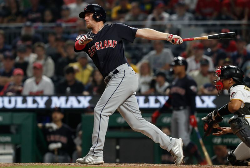 Jul 17, 2023; Pittsburgh, Pennsylvania, USA;  Cleveland Guardians center fielder Myles Straw (7) hits a double against the Pittsburgh Pirates during the eighth inning at PNC Park. The Guardians shutout the Pirates 11-0. Mandatory Credit: Charles LeClaire-USA TODAY Sports