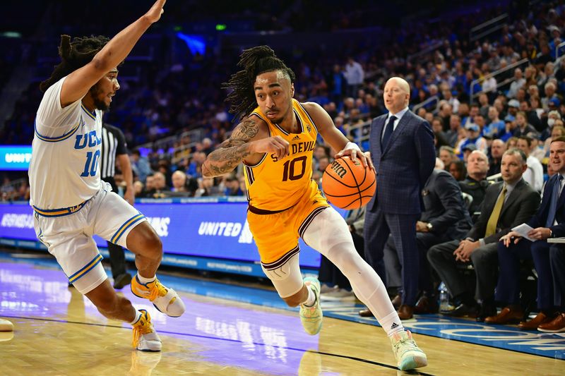 Mar 2, 2023; Los Angeles, California, USA; Arizona State Sun Devils guard Frankie Collins (10) moves the ball against UCLA Bruins guard Tyger Campbell (10) during the first half at Pauley Pavilion. Mandatory Credit: Gary A. Vasquez-USA TODAY Sports