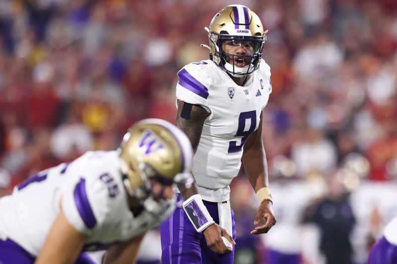 Nov 4, 2023; Los Angeles, California, USA; Washington Huskies quarterback Michael Penix Jr. (9) calls a play during the second quarter against the USC Trojans at United Airlines Field at Los Angeles Memorial Coliseum. Mandatory Credit: Jessica Alcheh-USA TODAY Sports