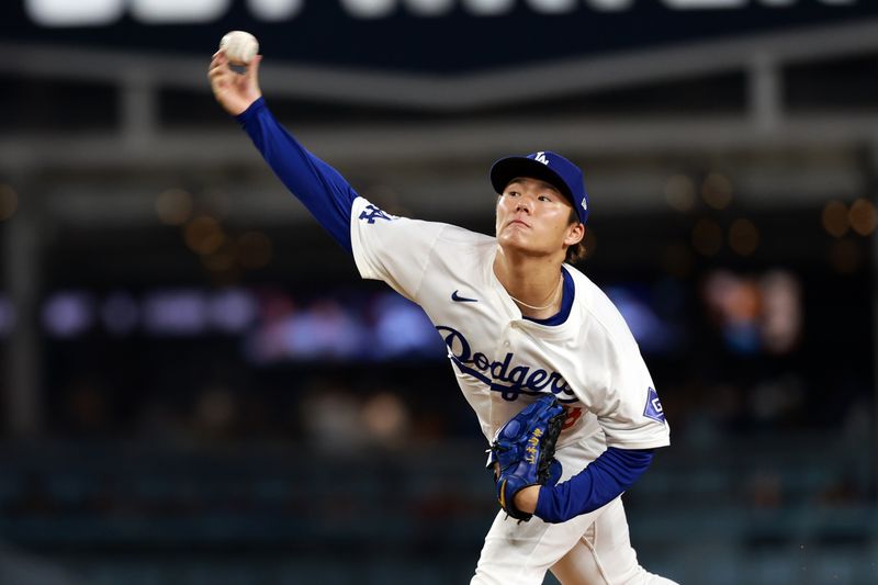 Apr 19, 2024; Los Angeles, California, USA;  Los Angeles Dodgers pitcher Yoshinobu Yamamoto (18) pitches during the fourth inning against the New York Mets at Dodger Stadium. Mandatory Credit: Kiyoshi Mio-USA TODAY Sports