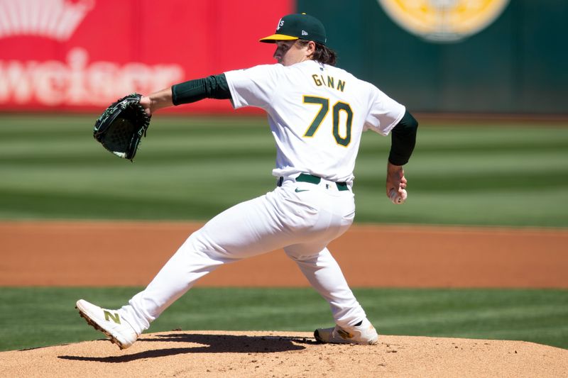 Sep 8, 2024; Oakland, California, USA; Oakland Athletics starting pitcher J.T. Ginn (70) delivers a pitch against the Detroit Tigers during the first inning at Oakland-Alameda County Coliseum. Mandatory Credit: D. Ross Cameron-Imagn Images