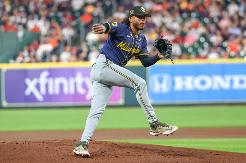 May 17, 2024; Houston, Texas, USA; Milwaukee Brewers starting pitcher Freddy Peralta (51) pitches against the Houston Astros in the first inning at Minute Maid Park. Mandatory Credit: Thomas Shea-USA TODAY Sports