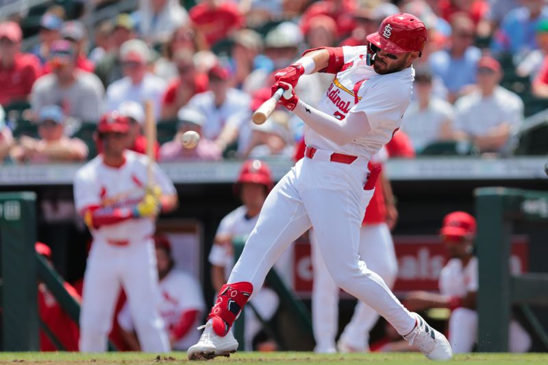 Mar 15, 2025; Jupiter, Florida, USA;  St. Louis Cardinals center fielder Michael Siani (22) hits a single against the Toronto Blue Jays during the second inning at Roger Dean Chevrolet Stadium. Mandatory Credit: Sam Navarro-Imagn Images