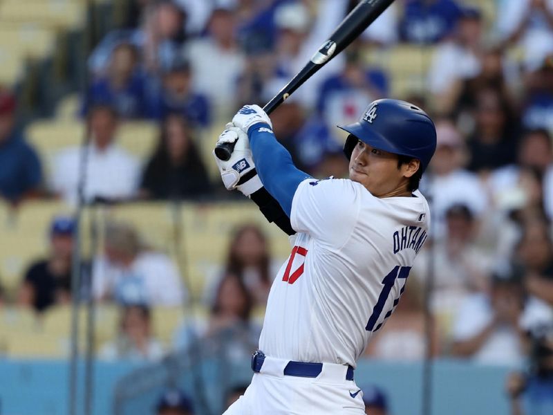 Jul 2, 2024; Los Angeles, California, USA;  Los Angeles Dodgers designated hitter Shohei Ohtani (17) hits a double during the first inning against the Arizona Diamondbacks at Dodger Stadium. Mandatory Credit: Kiyoshi Mio-USA TODAY Sports