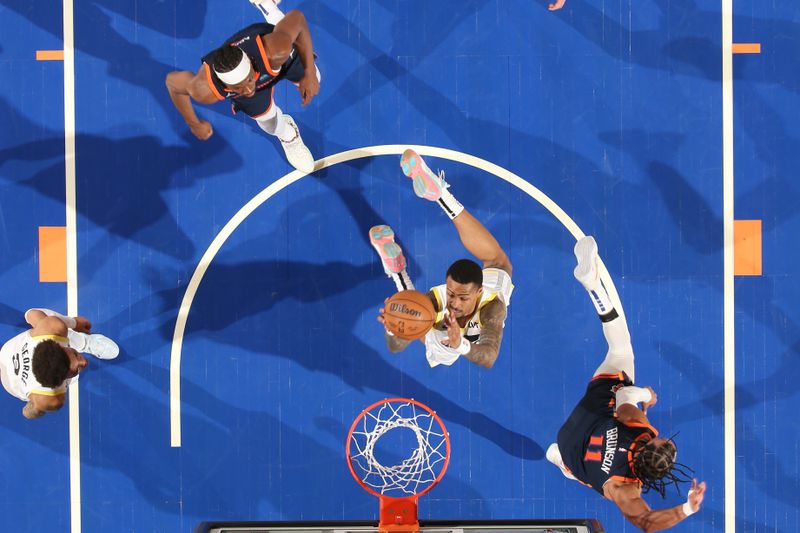 NEW YORK, NY - JANUARY 30: John Collins #20 of the Utah Jazz drives to the basket during the game against the New York Knicks on January 30, 2024 at Madison Square Garden in New York City, New York.  NOTE TO USER: User expressly acknowledges and agrees that, by downloading and or using this photograph, User is consenting to the terms and conditions of the Getty Images License Agreement. Mandatory Copyright Notice: Copyright 2024 NBAE  (Photo by Nathaniel S. Butler/NBAE via Getty Images)