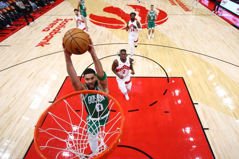 TORONTO, CANADA - OCTOBER 15: Jayson Tatum #0 of the Boston Celtics dunks the ball during the game against the Toronto Raptors on October 15, 2024 at the Scotiabank Arena in Toronto, Ontario, Canada.  NOTE TO USER: User expressly acknowledges and agrees that, by downloading and or using this Photograph, user is consenting to the terms and conditions of the Getty Images License Agreement.  Mandatory Copyright Notice: Copyright 2024 NBAE (Photo by Vaughn Ridley/NBAE via Getty Images)