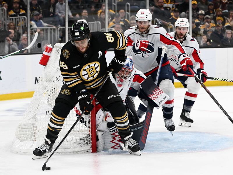 Feb 10, 2024; Boston, Massachusetts, USA; Boston Bruins right wing David Pastrnak (88) controls the puck in front of Washington Capitals goaltender Charlie Lindgren (79) during the third period at the TD Garden. Mandatory Credit: Brian Fluharty-USA TODAY Sports