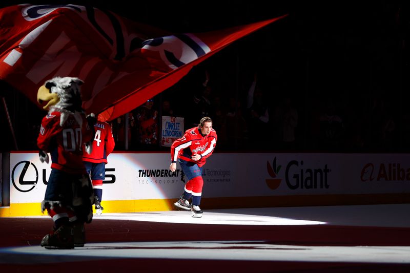 Mar 26, 2024; Washington, District of Columbia, USA; Washington Capitals center Dylan Strome (17) skates back onto the ice after being named the first start of the game after scoring the game winning goal in overtime against the Detroit Red Wings at Capital One Arena. Mandatory Credit: Amber Searls-USA TODAY Sports