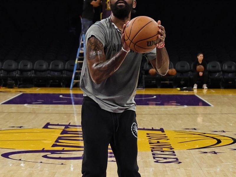 LOS ANGELES, CA - JANUARY 18: Kyrie Irving #11 of the Dallas Mavericks warms up before the game against the Los Angeles Lakers on January 18, 2024 at Crypto.Com Arena in Los Angeles, California. NOTE TO USER: User expressly acknowledges and agrees that, by downloading and/or using this Photograph, user is consenting to the terms and conditions of the Getty Images License Agreement. Mandatory Copyright Notice: Copyright 2024 NBAE (Photo by Jim Poorten/NBAE via Getty Images)