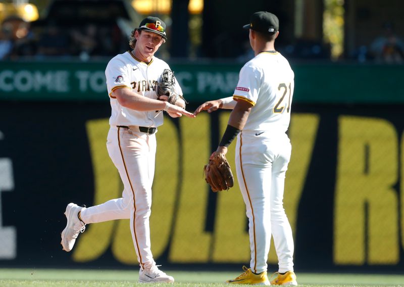 Sep 15, 2024; Pittsburgh, Pennsylvania, USA;  Pittsburgh Pirates right fielder Billy Cook (left) and second baseman Nick Gonzales (right) celebrate after defeating the Kansas City Royals at PNC Park. Mandatory Credit: Charles LeClaire-Imagn Images