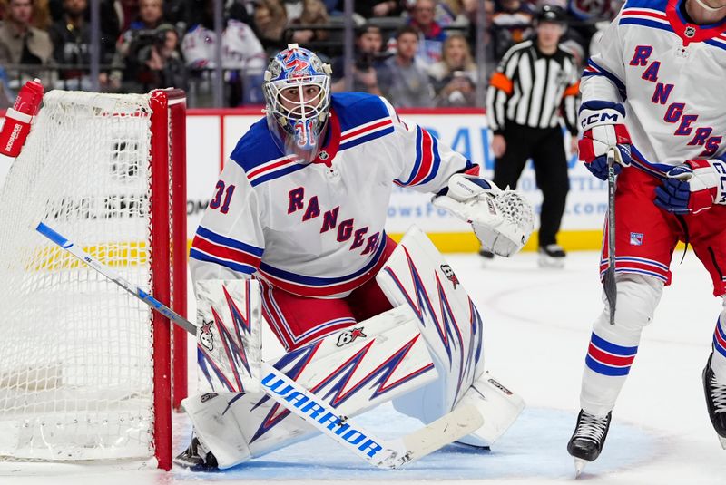 Jan 14, 2025; Denver, Colorado, USA; New York Rangers goaltender Igor Shesterkin (31) defends the net in the second period against the Colorado Avalanche at Ball Arena. Mandatory Credit: Ron Chenoy-Imagn Images