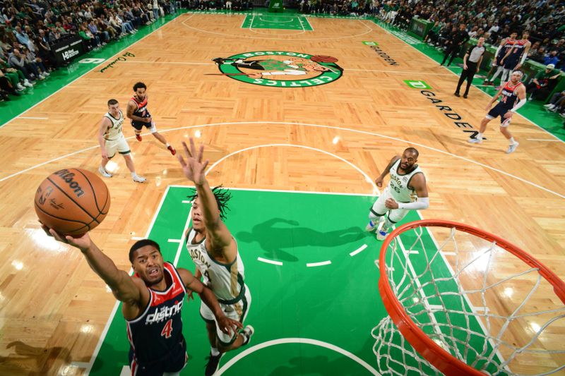 BOSTON, MA - APRIL 14: Jared Butler #4 of the Washington Wizards drives to the basket during the game  against the Boston Celtics on April 14, 2024 at the TD Garden in Boston, Massachusetts. NOTE TO USER: User expressly acknowledges and agrees that, by downloading and or using this photograph, User is consenting to the terms and conditions of the Getty Images License Agreement. Mandatory Copyright Notice: Copyright 2024 NBAE  (Photo by Brian Babineau/NBAE via Getty Images)