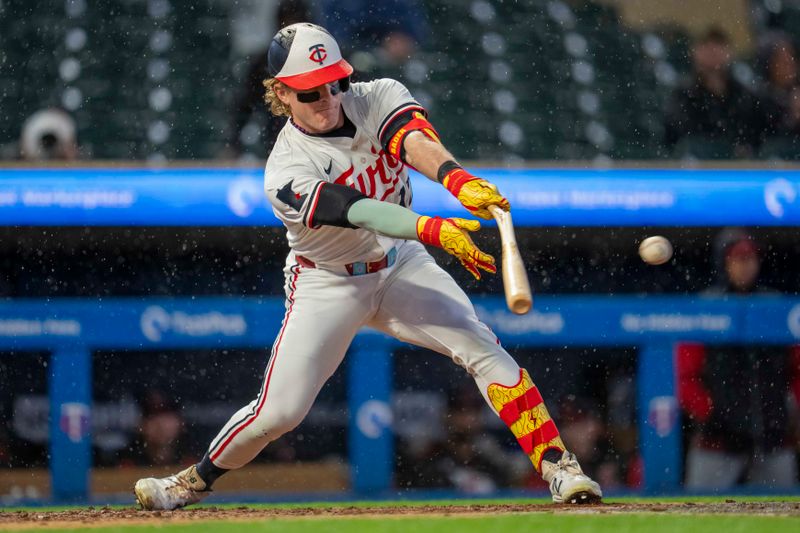 May 19, 2025; Minneapolis, Minnesota, USA; Minnesota Twins center fielder Harrison Bader (12) swings and breaks his bat against the Cleveland Guardians in the second inning at Target Field. Mandatory Credit: Jesse Johnson-Imagn Images