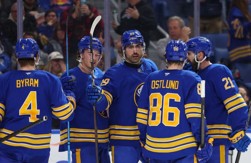 Dec 1, 2025; Buffalo, New York, USA;  Buffalo Sabres right wing Alex Tuch (89) celebrates his goal with teammates during the second period against the Winnipeg Jets at KeyBank Center. Mandatory Credit: Timothy T. Ludwig-Imagn Images