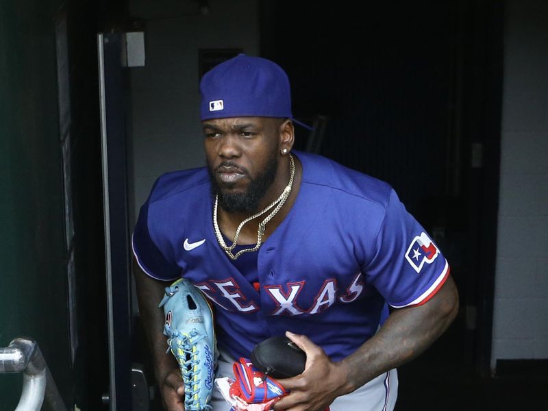 May 24, 2023; Pittsburgh, Pennsylvania, USA; Texas Rangers right fielder Adolis Garcia (53) enters the dugout to play the Pittsburgh Pirates at PNC Park. Mandatory Credit: Charles LeClaire-USA TODAY Sports