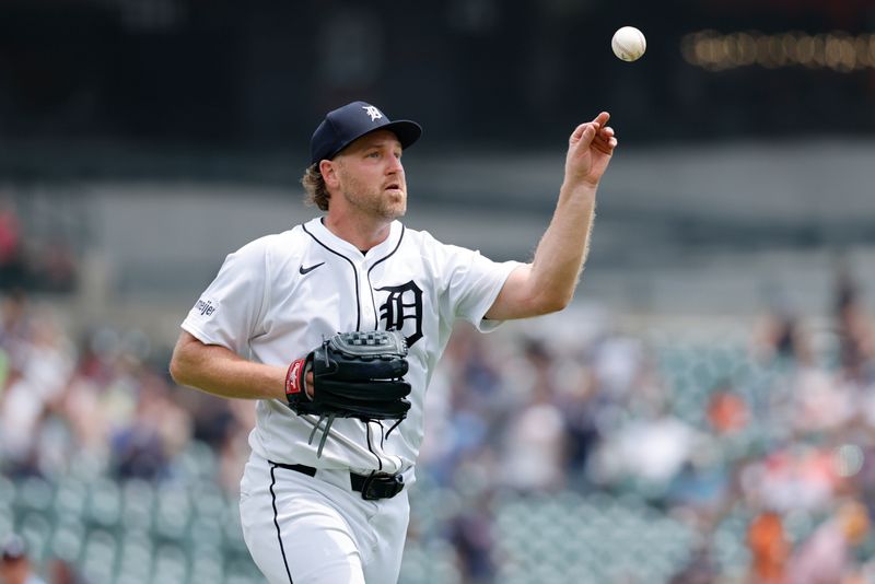 Jun 26, 2025; Detroit, Michigan, USA;  Detroit Tigers pitcher Dietrich Enns (51) makes a throw to first in the first inning against the Athletics at Comerica Park. Mandatory Credit: Rick Osentoski-Imagn Images
