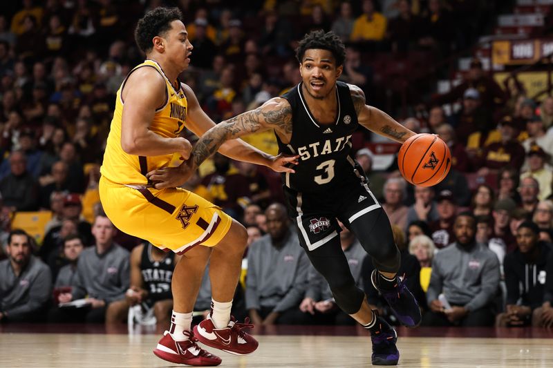 Dec 11, 2022; Minneapolis, Minnesota, USA; Mississippi State Bulldogs guard Shakeel Moore (3) drives to the basket while Minnesota Golden Gophers guard Taurus Samuels (0) defends during the second half at Williams Arena. Mandatory Credit: Matt Krohn-USA TODAY Sports