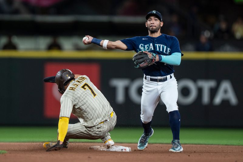 Aug 8, 2023; Seattle, Washington, USA; Seattle Marinerssecond baseman Jose Caballero (76) attempts to turn a double play after forcing out San Diego Padres second baseman Ha-Seong Kim (7) during the ninth inning at T-Mobile Park. Mandatory Credit: Stephen Brashear-USA TODAY Sports