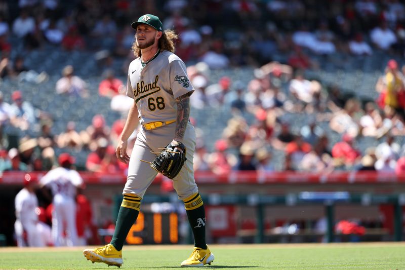 Jun 26, 2024; Anaheim, California, USA;  Oakland Athletics starting pitcher Joey Estes (68) walks back to the dugout after being relieved from the game during the sixth inning against the Los Angeles Angels at Angel Stadium. Mandatory Credit: Kiyoshi Mio-USA TODAY Sports