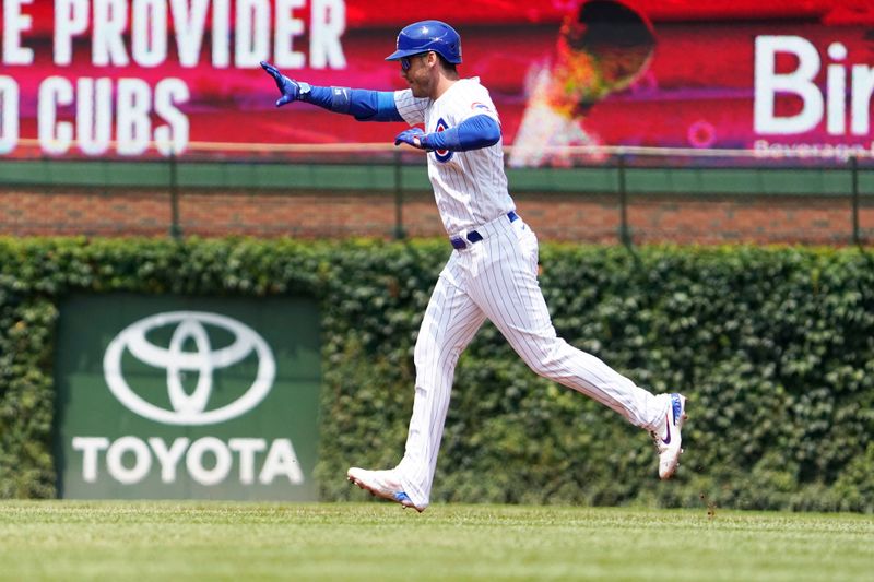 Jul 23, 2023; Chicago, Illinois, USA; Chicago Cubs center fielder Cody Bellinger (24) runs the bases after hitting a two-run homer against the St. Louis Cardinals during the first inning at Wrigley Field. Mandatory Credit: David Banks-USA TODAY Sports