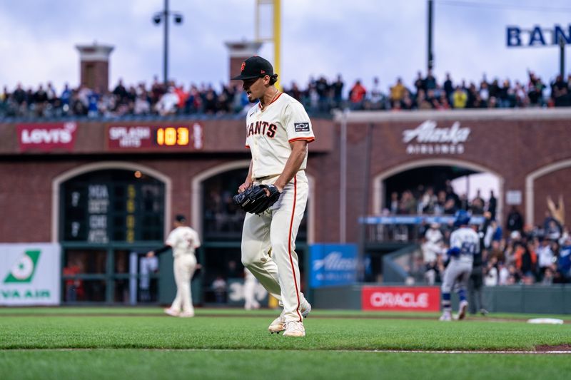 May 13, 2024; San Francisco, California, USA; San Francisco Giants starting pitcher Jordan Hicks (12) celebrates after the catch by San Francisco Giants outfielder Mike Yastrzemski (not pictured) against the Los Angeles Dodgers during the fifth inning at Oracle Park. Mandatory Credit: Neville E. Guard-USA TODAY Sports