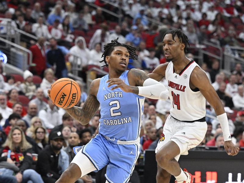 Jan 14, 2023; Louisville, Kentucky, USA;  North Carolina Tar Heels guard Caleb Love (2) drives to the basket against Louisville Cardinals forward Jae'Lyn Withers (24) during the first half at KFC Yum! Center. Mandatory Credit: Jamie Rhodes-USA TODAY Sports