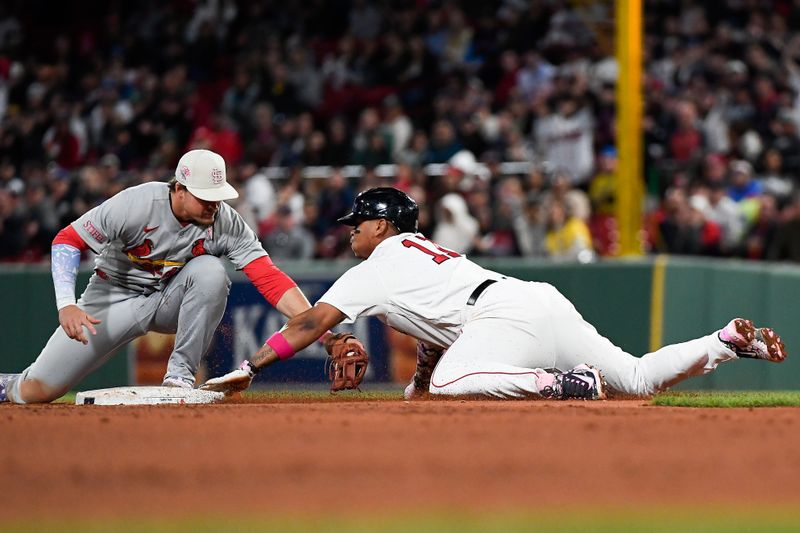 May 14, 2023; Boston, Massachusetts, USA; Boston Red Sox third baseman Rafael Devers (11) is tagged out at second base by St. Louis Cardinals second baseman Nolan Gorman (16) during the fourth inning at Fenway Park. Mandatory Credit: Eric Canha-USA TODAY Sports