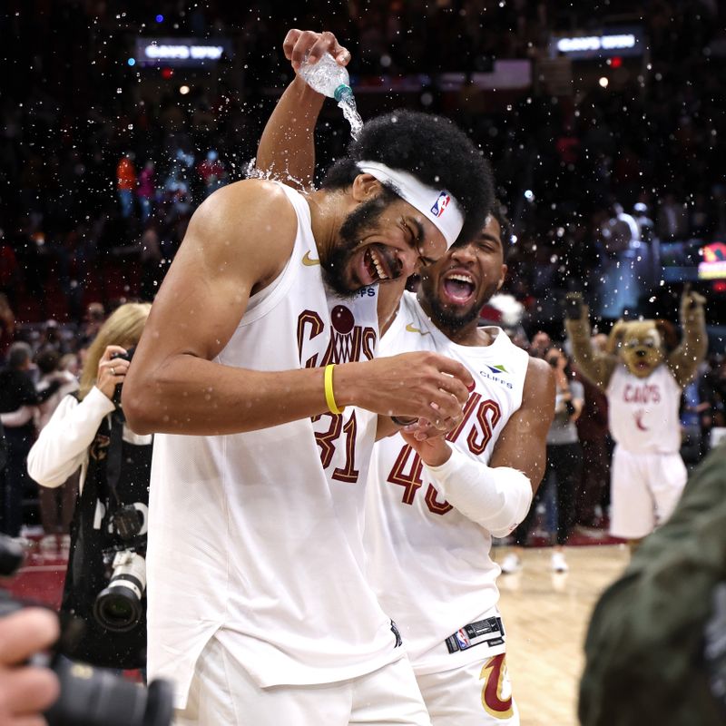 CLEVELAND, OH - JANUARY 8: Jarrett Allen #31 and Donovan Mitchell #45 of the Cleveland Cavaliers celebrate after the game against the Oklahoma City Thunder  on January 8, 2025 at Rocket Mortgage FieldHouse in Cleveland, Ohio. NOTE TO USER: User expressly acknowledges and agrees that, by downloading and/or using this Photograph, user is consenting to the terms and conditions of the Getty Images License Agreement. Mandatory Copyright Notice: Copyright 2025 NBAE (Photo by  Lauren Leigh Bacho/NBAE via Getty Images)